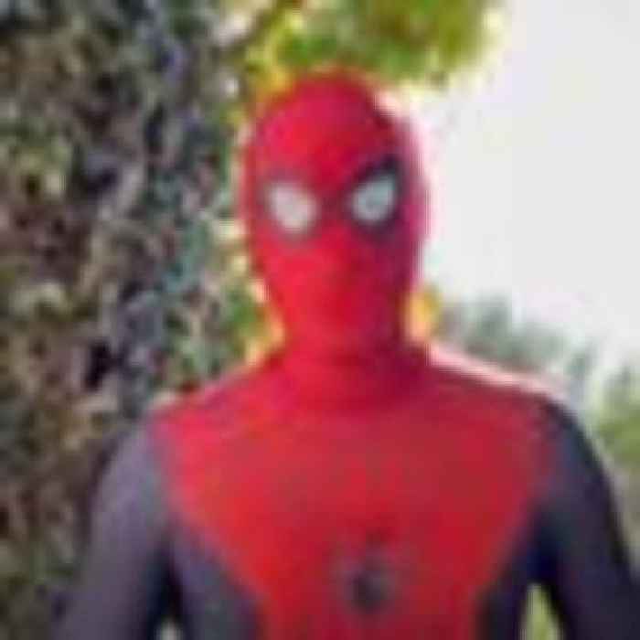 Who's under the mask? Unlikely Spider-Man sends Christmas message to bereaved children