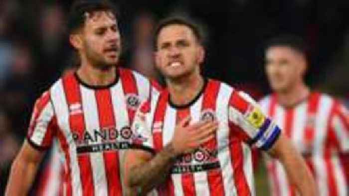 Blades beat Terriers to move level at top