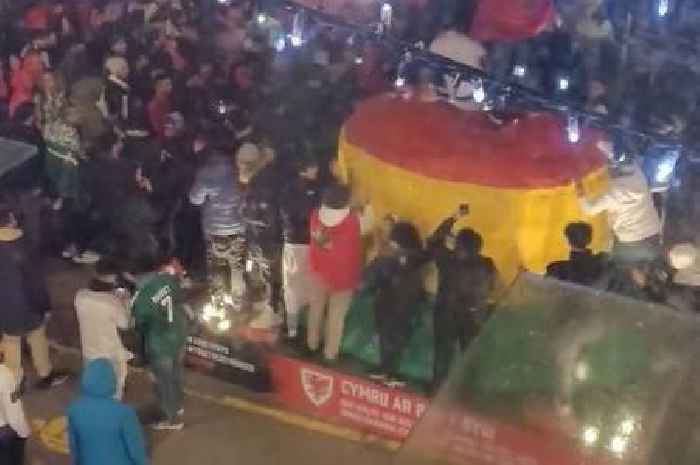 Jubilant Morocco fans climb on giant Welsh bucket hat as they celebrate historic World Cup win over Cristiano Ronaldo's Portugal
