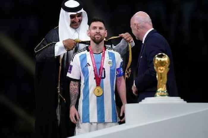 World Cup fans split by Messi robe given as ‘mark of honour’   while he lifts trophy