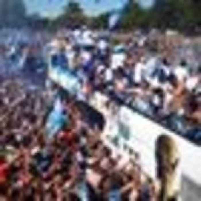 Argentina's World Cup heroes fly over huge crowds after bus parade cancelled due to safety fears