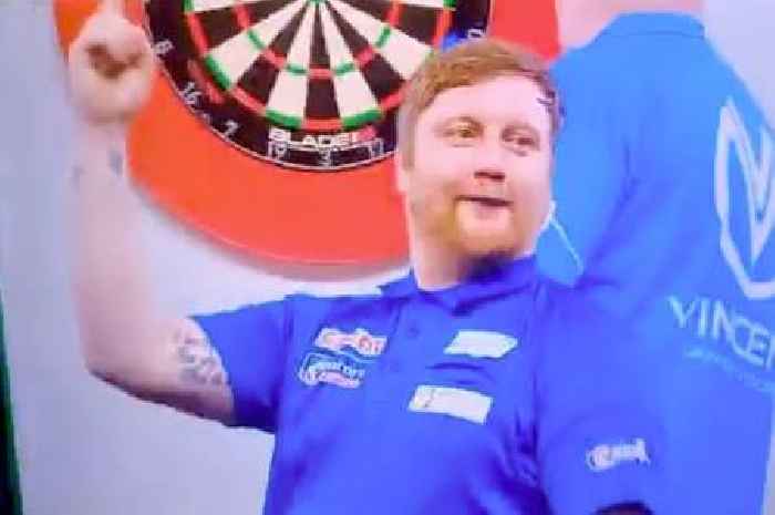 Darts maverick Cameron Menzies sings along with crowd - who are chanting for his opponent