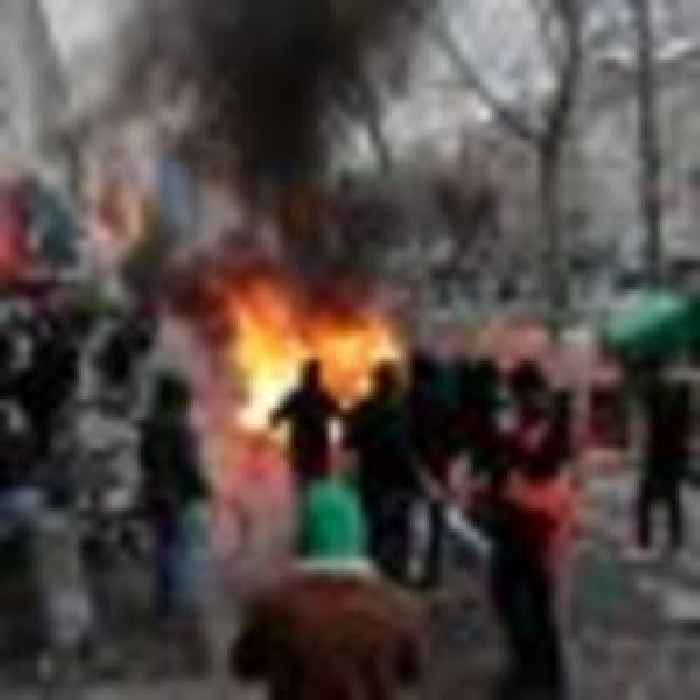 Protesters clash with police in Paris after three killed in shooting