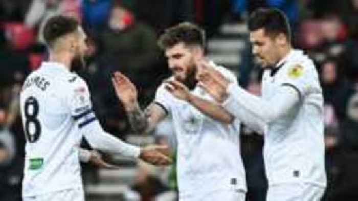 Swansea triumph at 10-man Sunderland