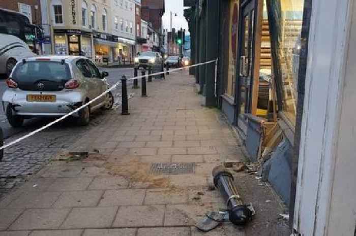 Car smashes through high street shop after driver reverses into building