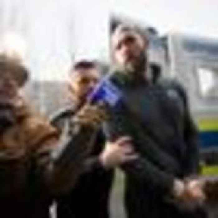Handcuffed Andrew Tate hits out in Romania, saying 'there is no justice'