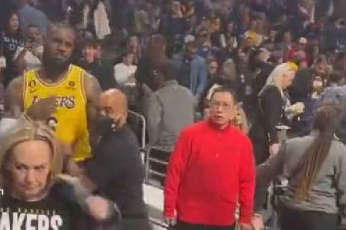 LeBron James held back by security after reacting to abusive heckles from NBA fan