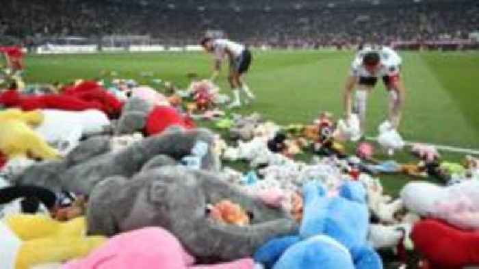 Besiktas fans throw thousands of toys on to pitch