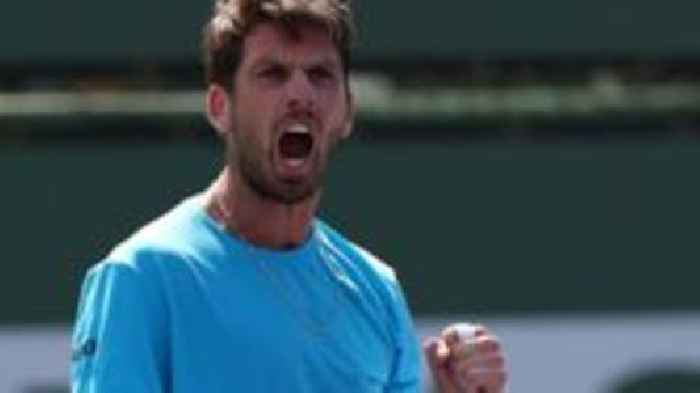 Norrie fights back to reach last 16
