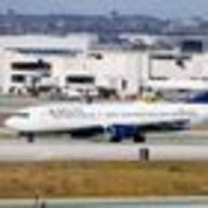 Passenger 'opens plane door and triggers emergency slide'