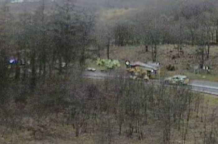 Four people rushed to hospital after car goes up in flames following crash on M80