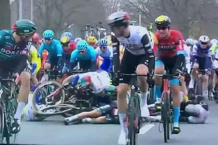 Cyclist causes colossal pile up after veering off the road and back into the peloton