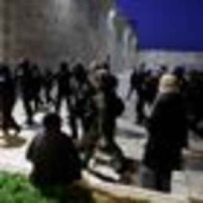 Israeli riot police fire stun grenades and tear gas in clashes with Palestinian worshippers