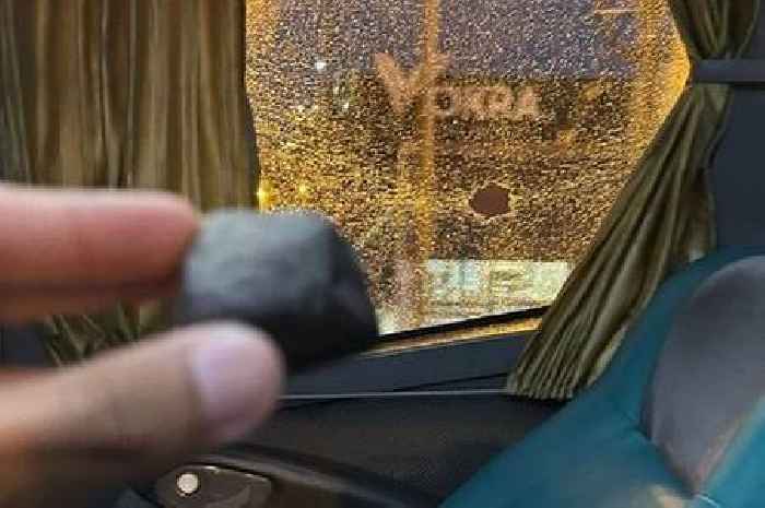 Idiotic football fans mistakenly throw stones at own team's bus as player shouts 'it's us'