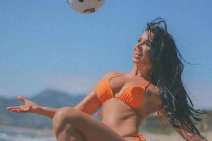 World Cup's sexiest fan has fans in awe as she plays football in tiny orange bikini on beach