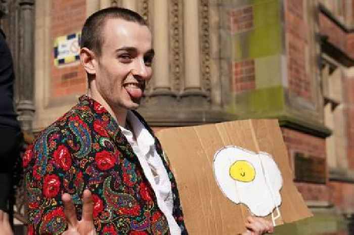 Student who 'threw egg at King Charles' poses with egg sign outside court