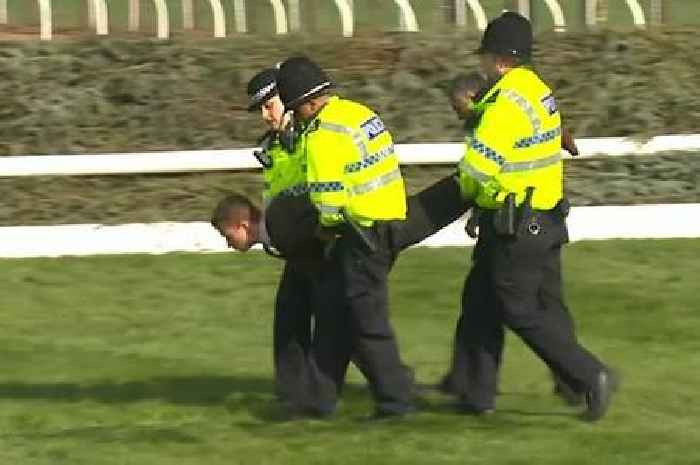 Grand National delayed after protesters storm onto racecourse at Aintree