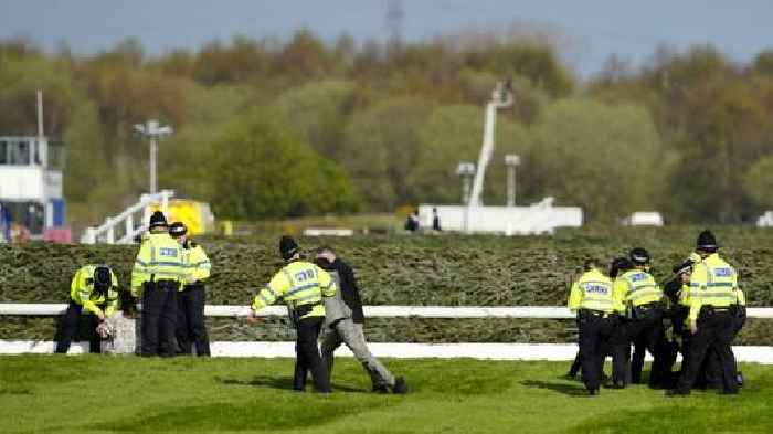 More than 100 arrested as activists delay Grand National horse race