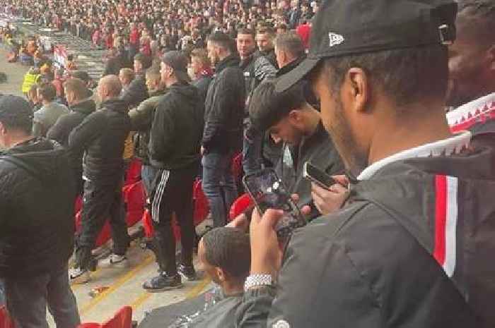 Bored Man Utd fan spotted getting a trim in Wembley stands during 'dead game'