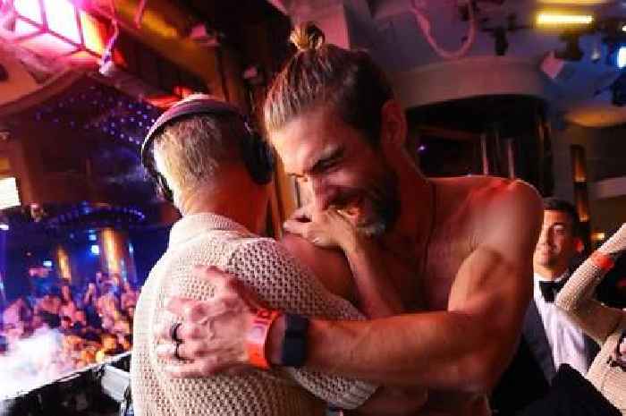 Olympic legend Michael Phelps lets loose as he parties with top off in DJ booth