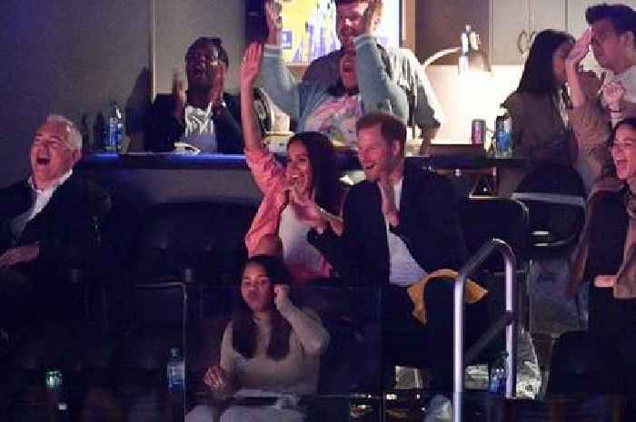 Prince Harry and Meghan Markle spotted giggling and smiling on kiss-cam at NBA game