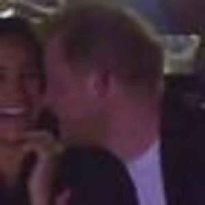 Prince Harry and Meghan seen on 'kiss cam' as their faces are beamed to 20,000 crowd at basketball game