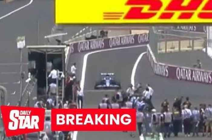 F1 horror as people nearly run down after flooding pit lane before race is over