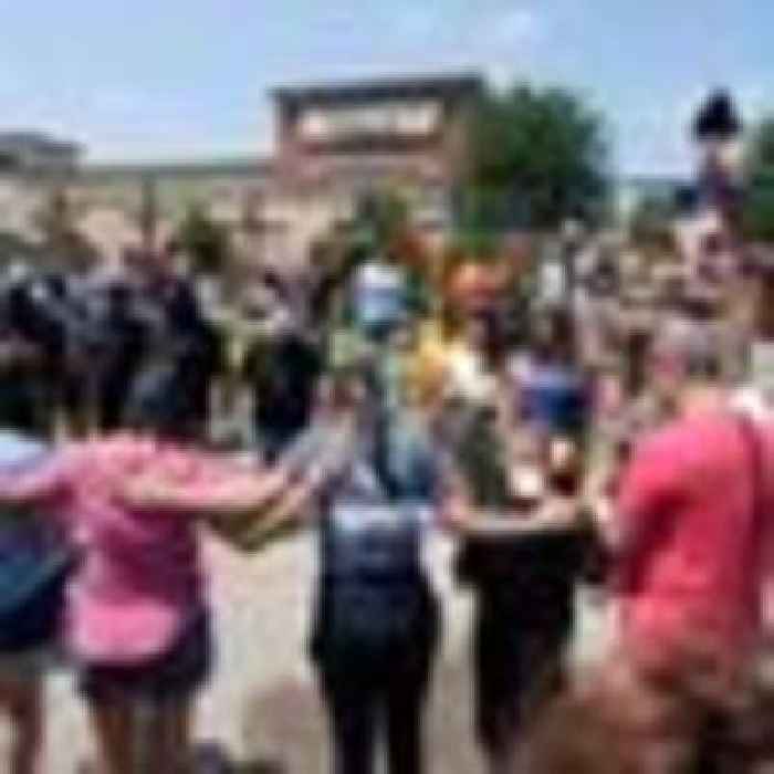 Three children among eight shot dead at US mall - as one boy left orphaned