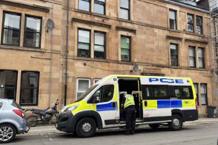 Neighbour of man and child found dead in Paisley flat heard 'screaming and shouting' before cops discovered bodies