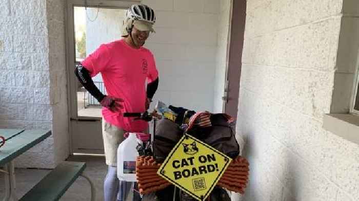 Man travels across the country by bike with cat