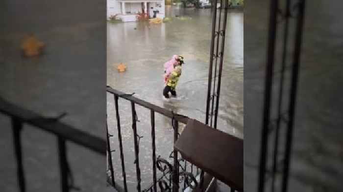 Firefighters rescue family trapped in flooding basement