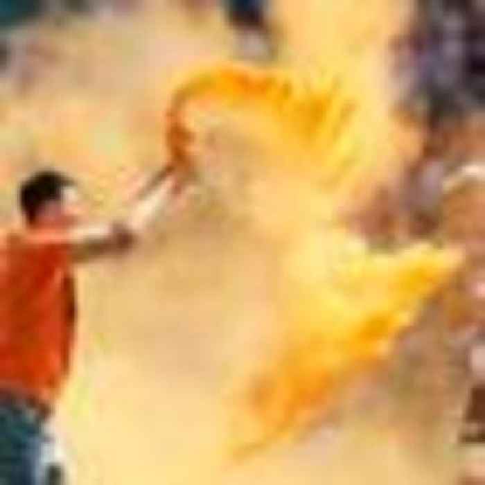 Protesters invade pitch and throw orange powder at Twickenham rugby final