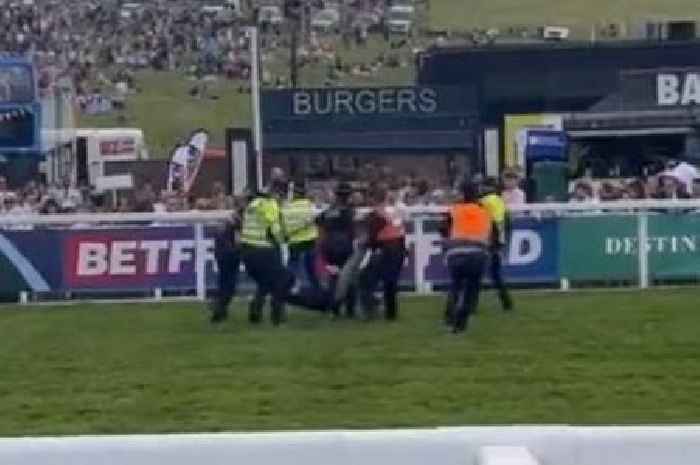 Protester dragged off course at Epsom Derby as he fails to ruin famous race