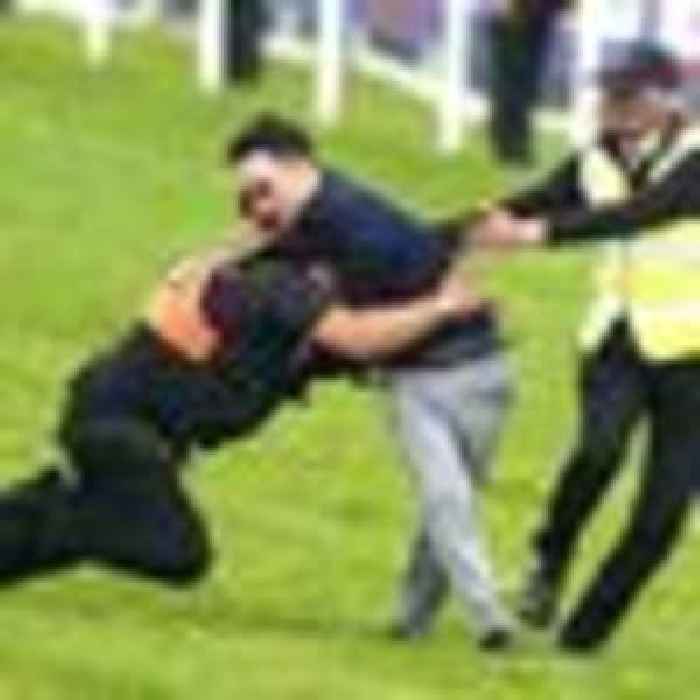 Nineteen arrested over plans to disrupt Epsom Derby - as protester runs on to racecourse