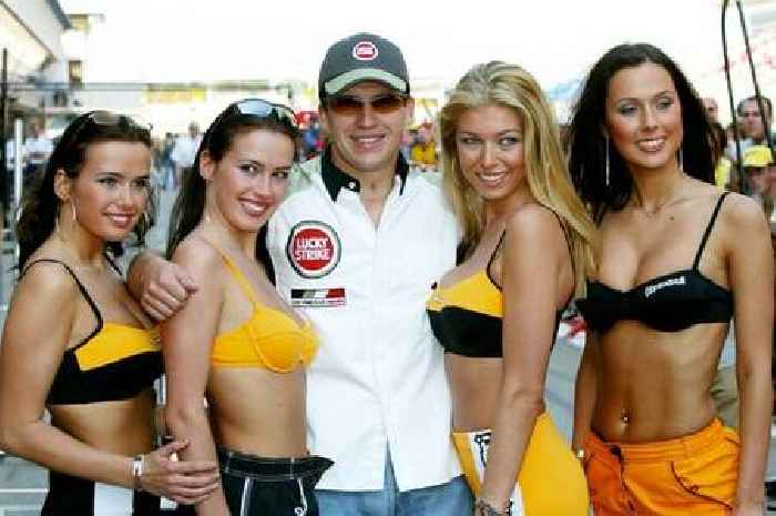 Ex-Monaco winner gave big smile as he posed with bikini-clad women at Spanish GP