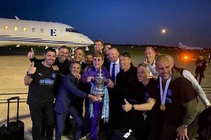 Guardiola and Man City staff bump into Elton John as they land in Manchester with FA Cup