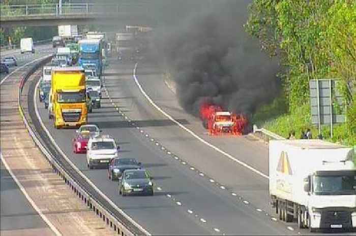 Live M11 traffic updates as car bursts into flames causing long delays