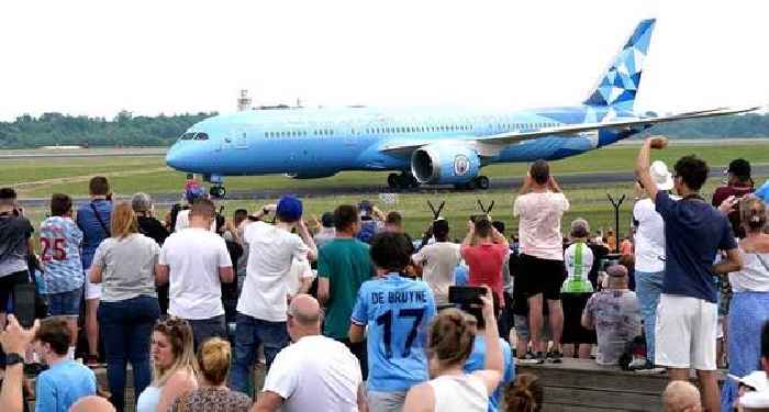 Man City plane lands back at Manchester airport as fans welcome home Treble heroes