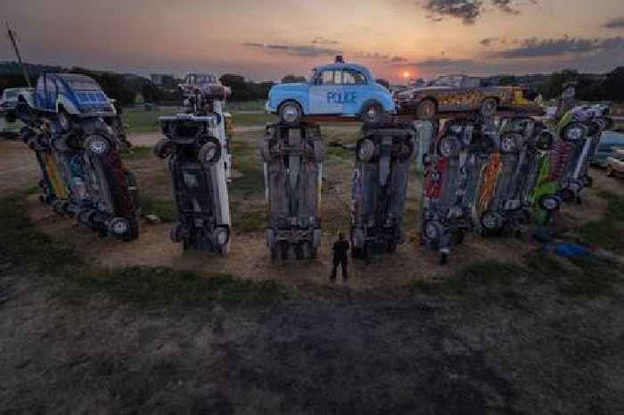 Summer solstice at Glastonbury Festival's very own quirky take on 'Stonehenge' using vintage cars