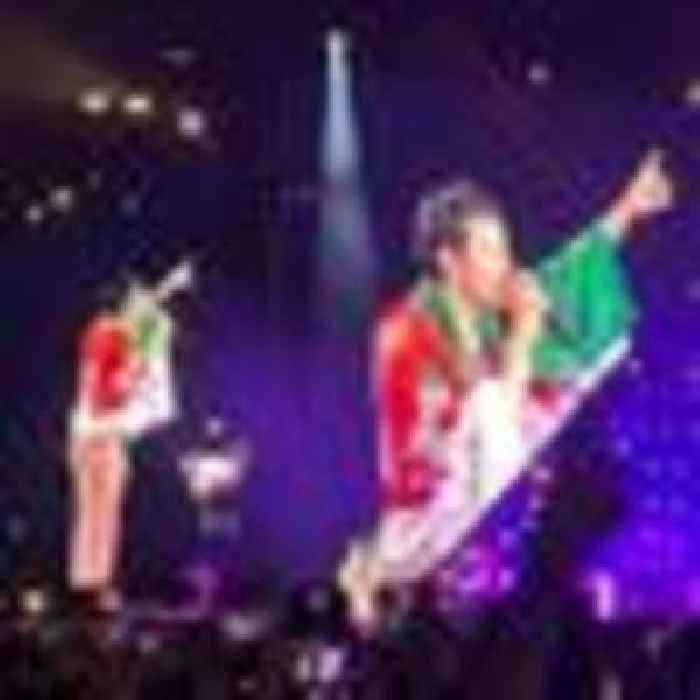 Harry Styles delights Cardiff fans by wearing Welsh flag on stage