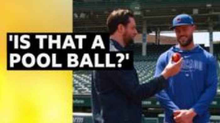 Felix White teaches cricket to Cubs baseball pair