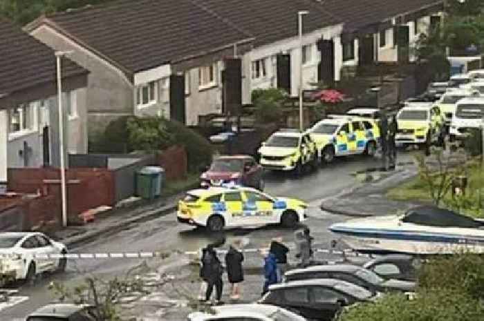 Man arrested after armed cops swarm Scots street with 'negotiators' at scene