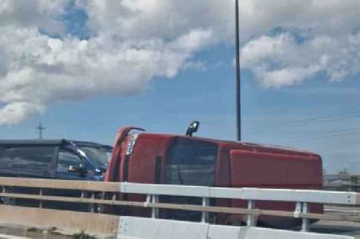 Live: M5 traffic stopped after car flips in crash with delays building