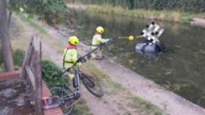 Boy rescued from hay bale in canal