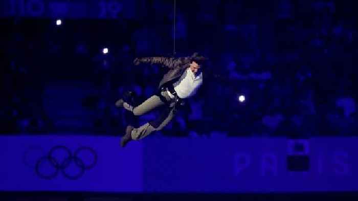 Paris Olympics closes with dystopian ceremony - and Tom Cruise abseiling into stadium