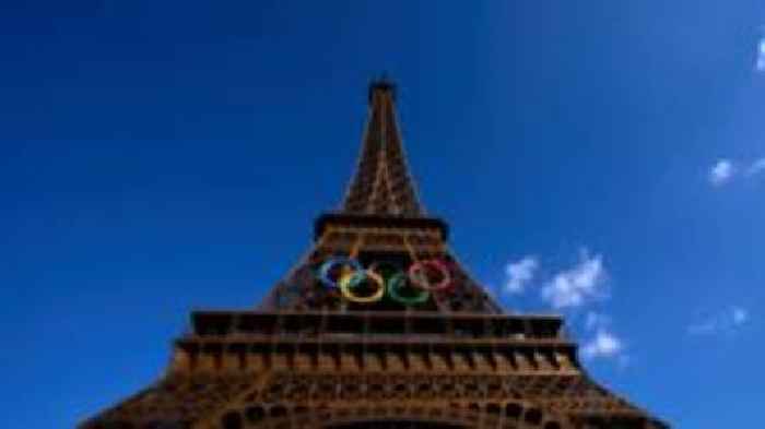 Man held for climbing Eiffel Tower on final Olympics day