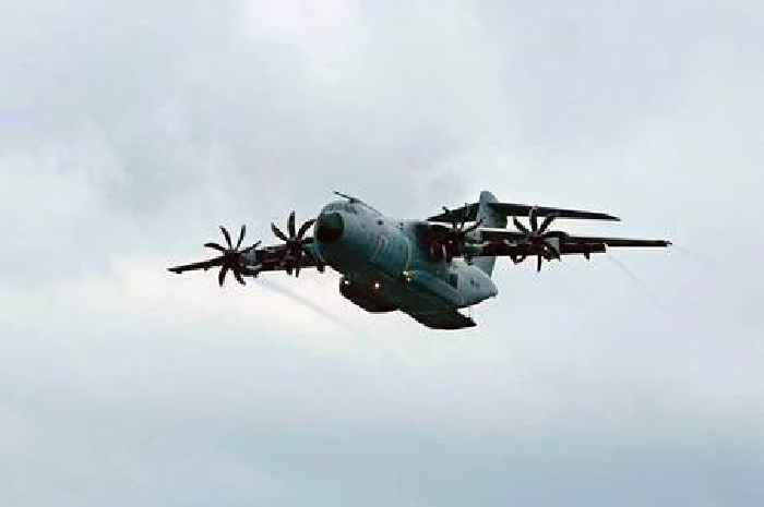 Giant military plane carrying soldiers terrifies people flying low over Wales with cargo door open