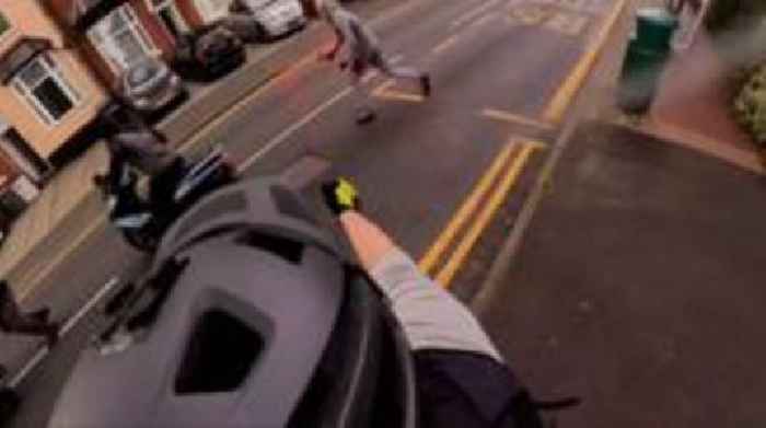 Video shows cyclist fighting off would-be robbers