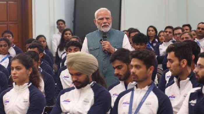 Hockey team presents signed stick as PM Modi hosts India`s Olympic contingent