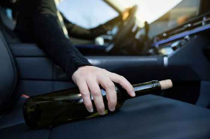 Drunken driver swigging from wine bottle mounted kerb to avoid police in Market Harborough